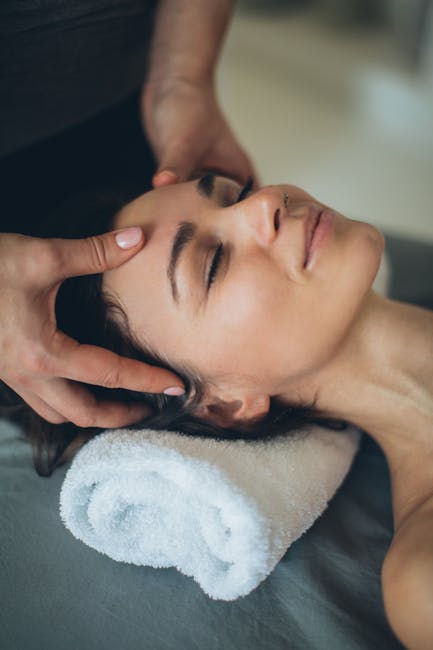 professional woman demonstrating eye massage technique with gentle finger movements around eye area